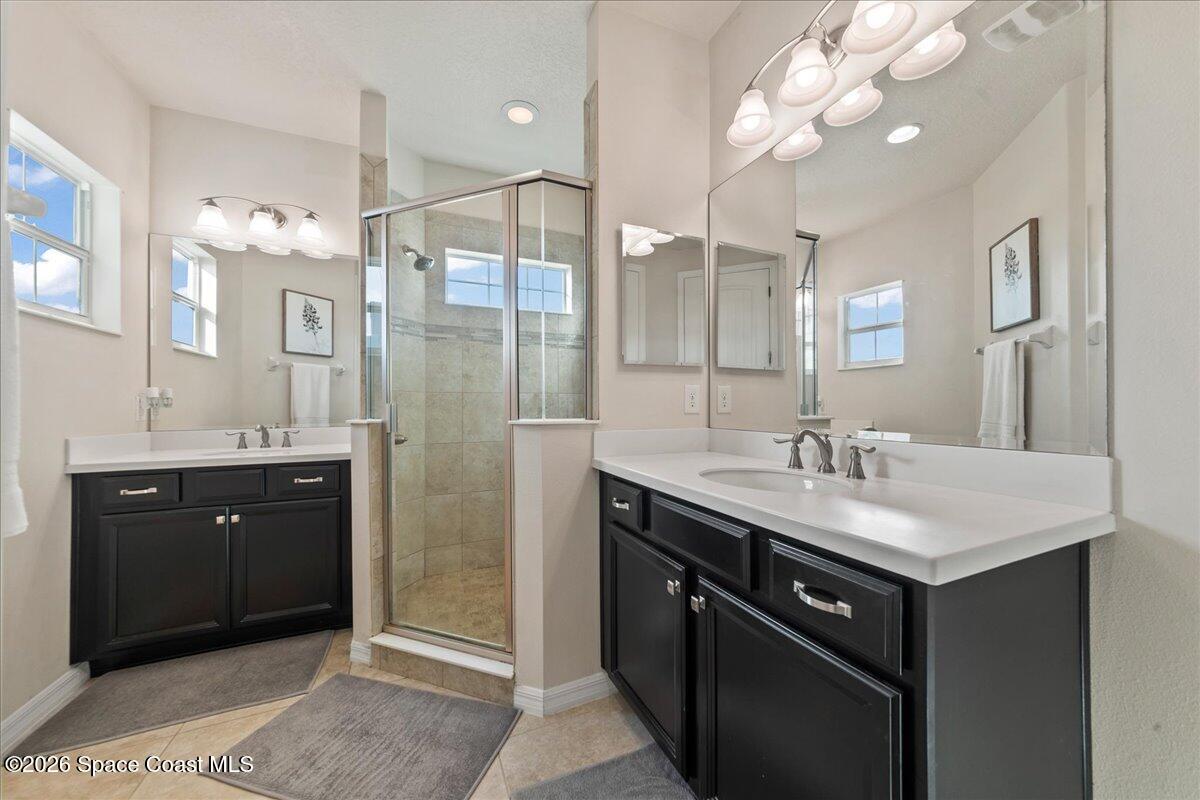 4938 Sprint Circle Rockledge, FL 32955 - Photo 6 of 37 a bathroom with a sink a double vanity and a mirror