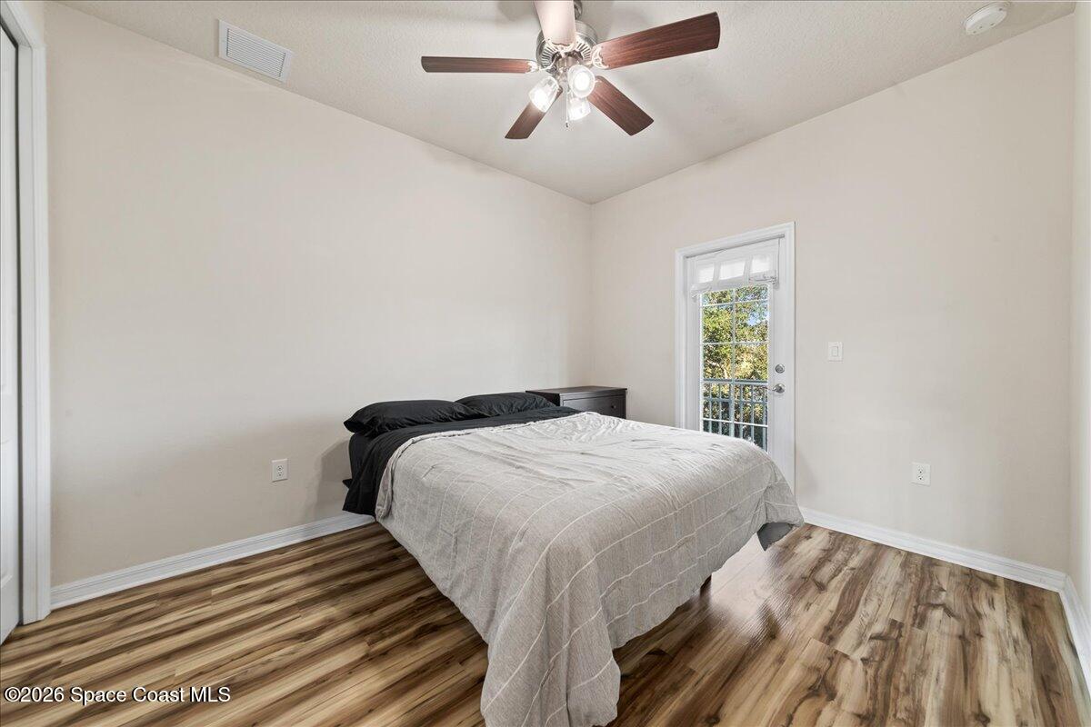 4938 Sprint Circle Rockledge, FL 32955 - Photo 7 of 37 a bedroom with a bed and a window