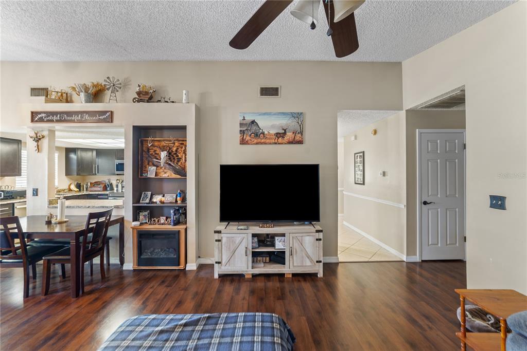 8715 Huntsman Lane Port Richey, FL 34668 - Photo 22 of 54 a view of living room with furniture and flat screen tv