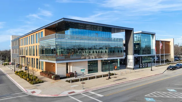 a view of a building with sitting area