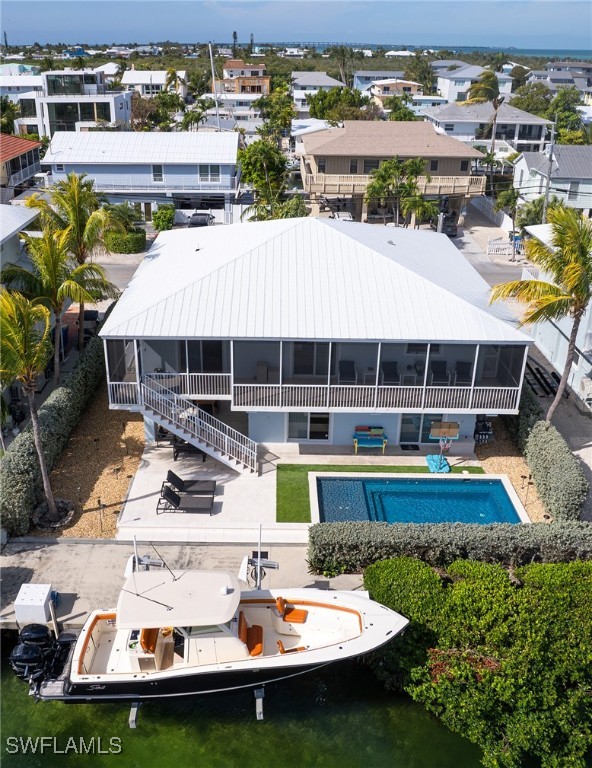 189 Gulfview Drive Islamorada, FL 33036 - Photo 11 of 49 a aerial view of a house with swimming pool lawn chairs and a yard