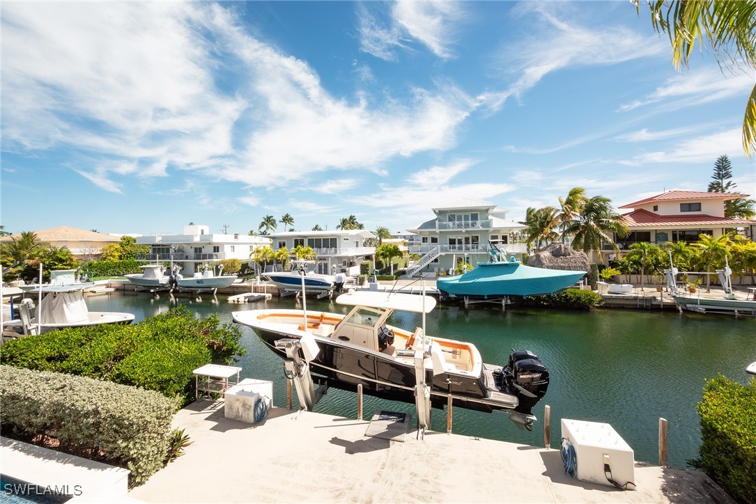 189 Gulfview Drive Islamorada, FL 33036 - Photo 12 of 49 a view of a lake with a table and chairs