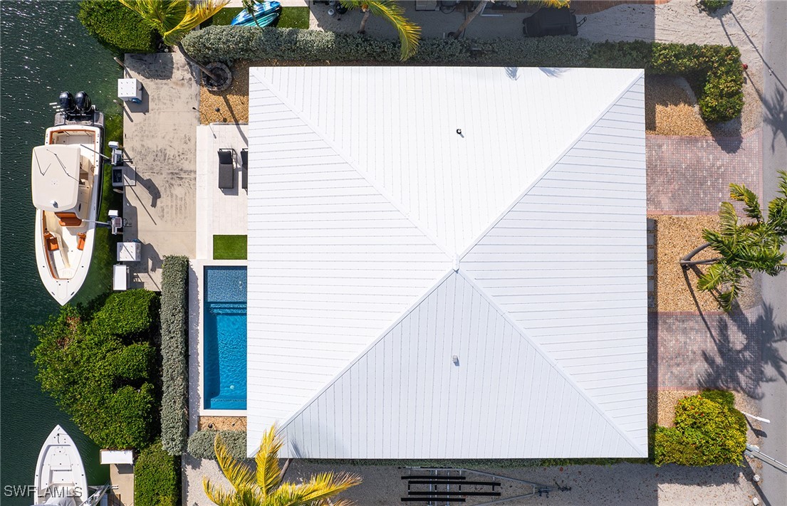 189 Gulfview Drive Islamorada, FL 33036 - Photo 13 of 49 a view of a large white building with wooden floor