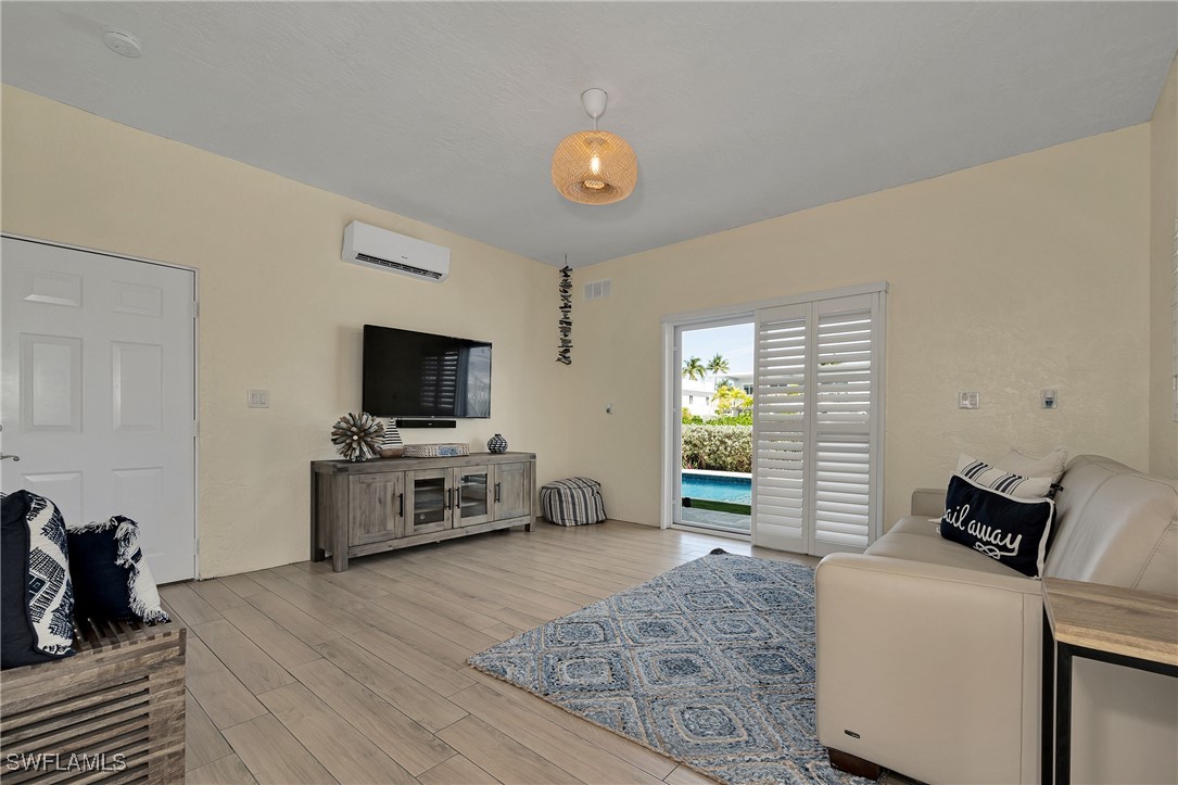 189 Gulfview Drive Islamorada, FL 33036 - Photo 15 of 49 a living room with furniture and a flat screen tv
