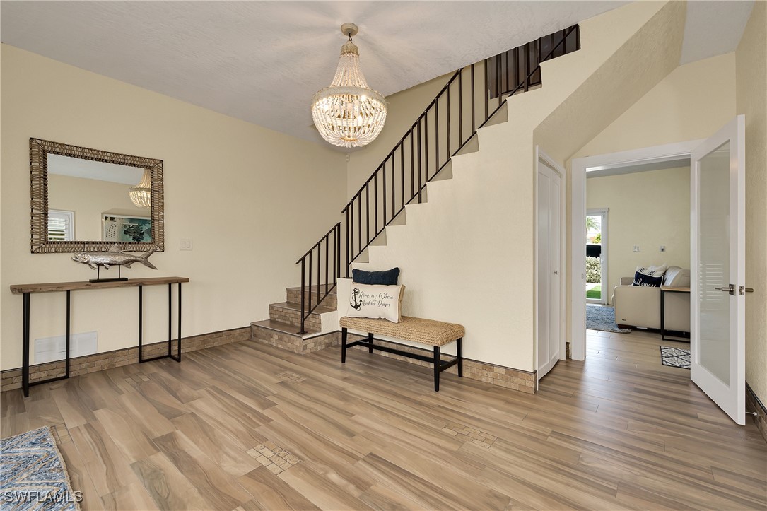 189 Gulfview Drive Islamorada, FL 33036 - Photo 18 of 49 a view of a hallway with wooden floor and staircase