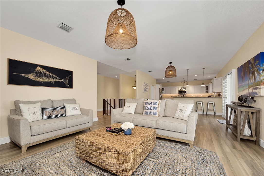 189 Gulfview Drive Islamorada, FL 33036 - Photo 26 of 49 a living room with furniture and a wooden floor