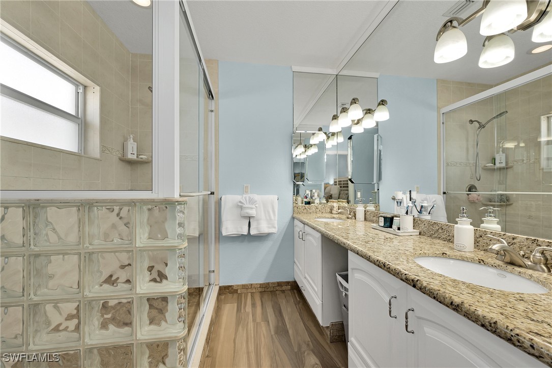 189 Gulfview Drive Islamorada, FL 33036 - Photo 36 of 49 a bathroom with a double vanity sink and a mirror