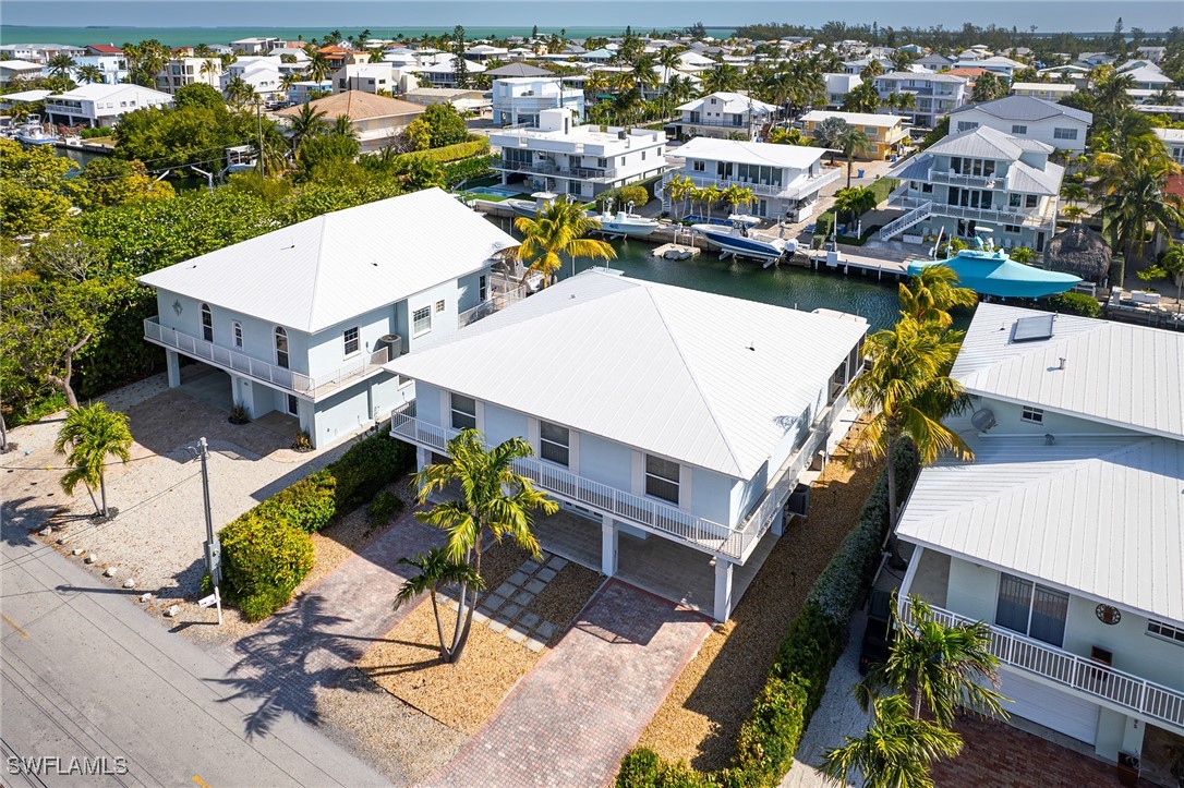 189 Gulfview Drive Islamorada, FL 33036 - Photo 5 of 49 an aerial view of a house with a swimming pool patio and outdoor seating