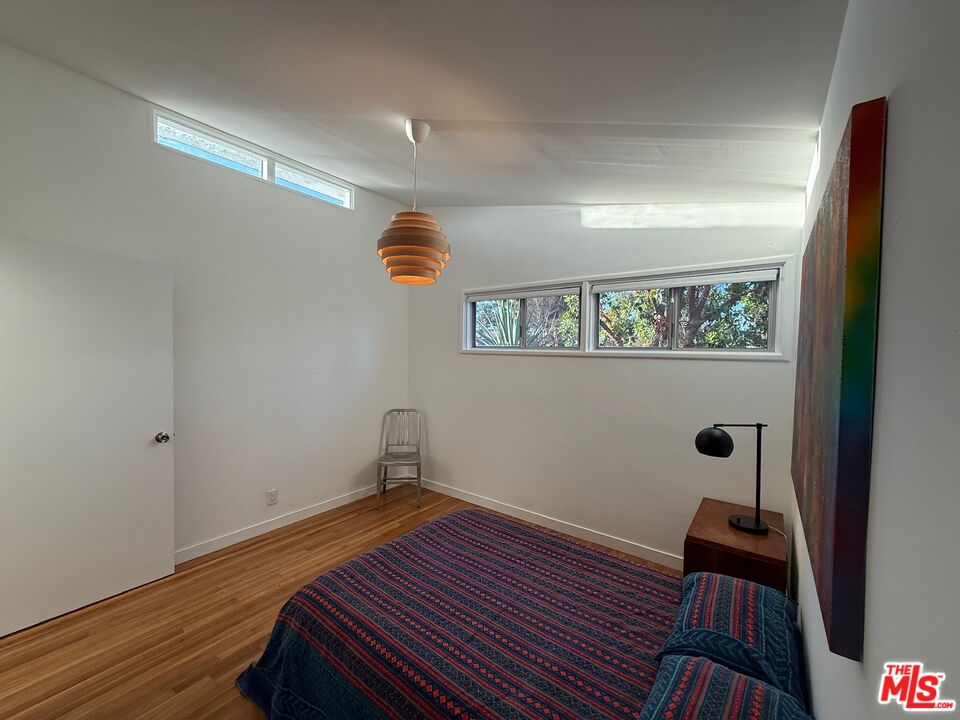5128 East Wardlow Road Long Beach, CA 90808 - Photo 15 of 35 a view of a hardwood floor and wardrobe