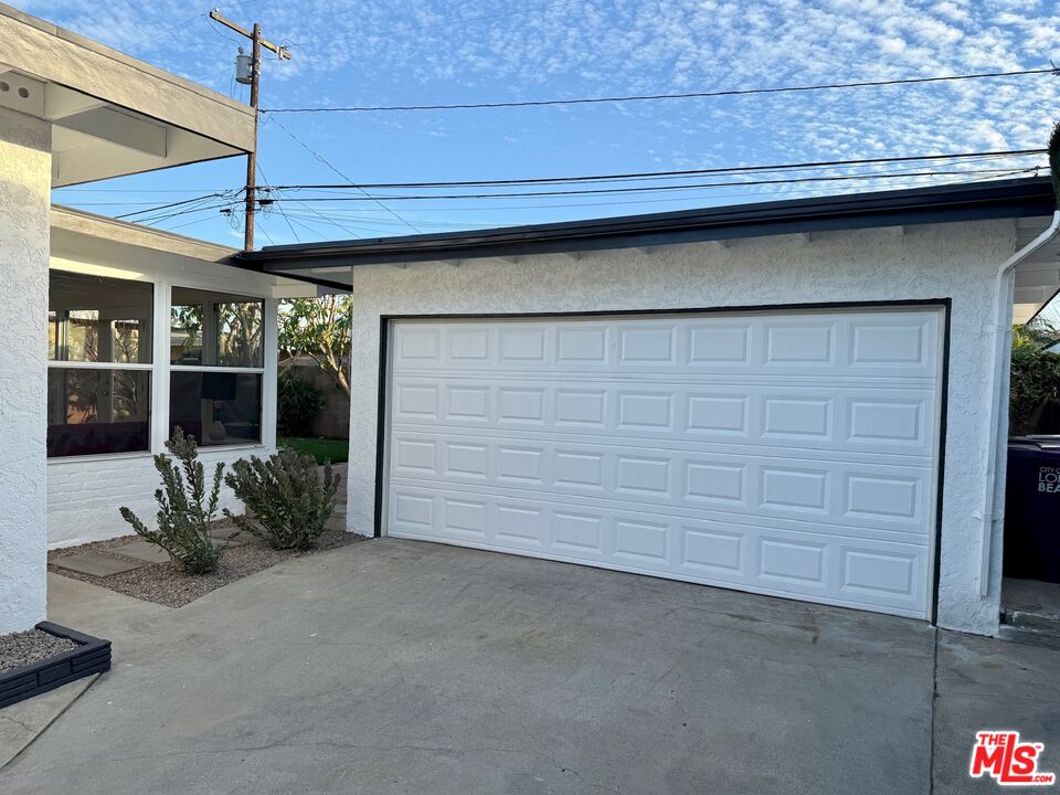 5128 East Wardlow Road Long Beach, CA 90808 - Photo 29 of 35 a view of a chair and table in front of house