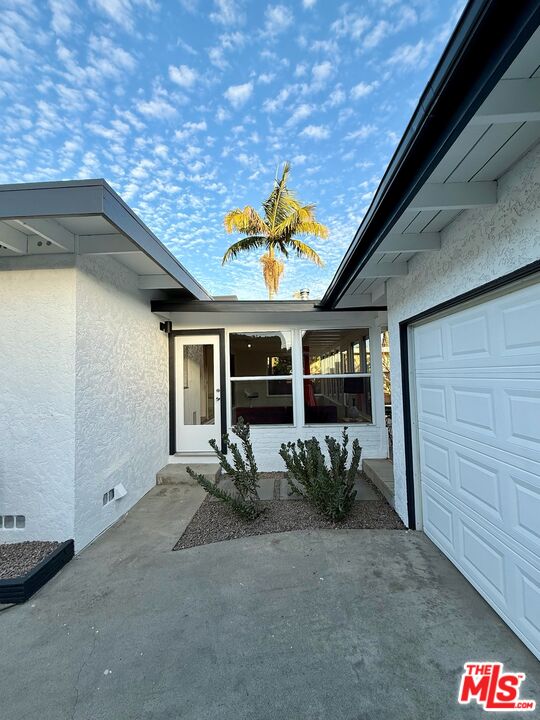 5128 East Wardlow Road Long Beach, CA 90808 - Photo 30 of 35 a view of a entryway door back of the house