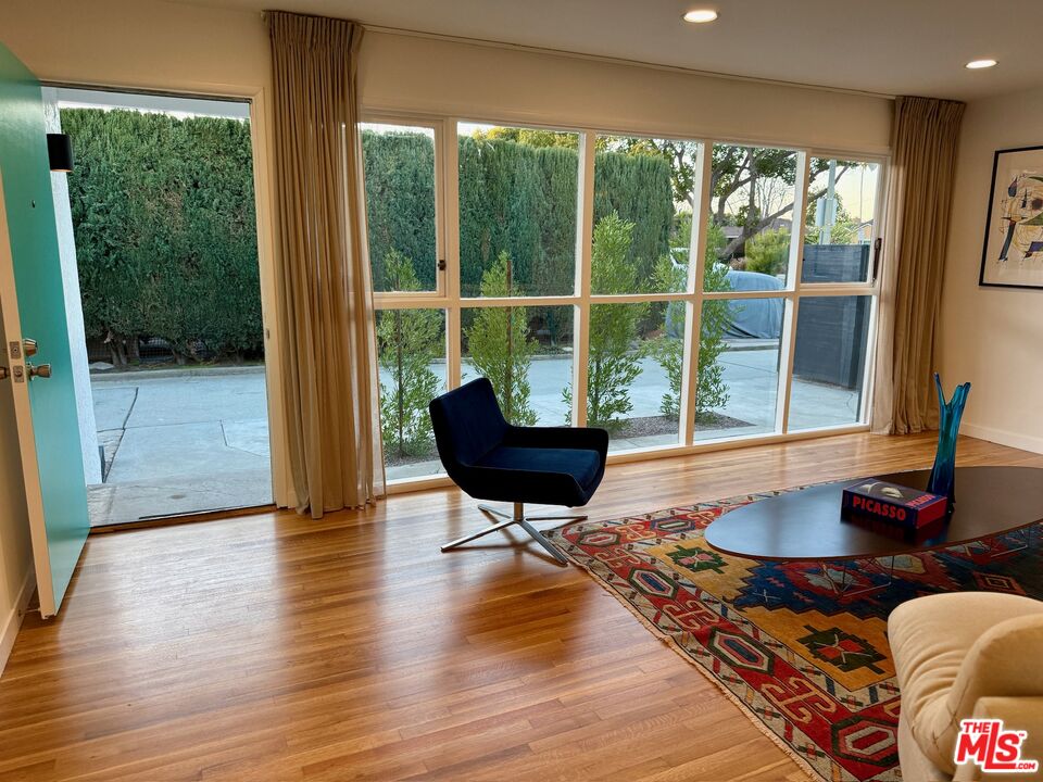 5128 East Wardlow Road Long Beach, CA 90808 - Photo 4 of 35 a living room with furniture and a large window