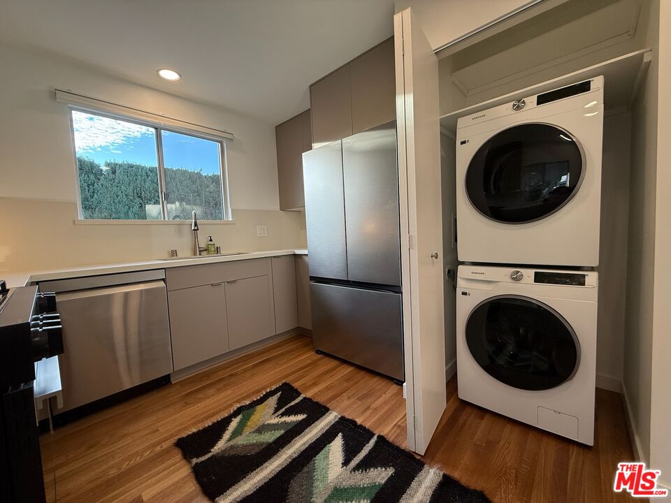 5128 East Wardlow Road Long Beach, CA 90808 - Photo 9 of 35 a view of a kitchen with washer and dryer