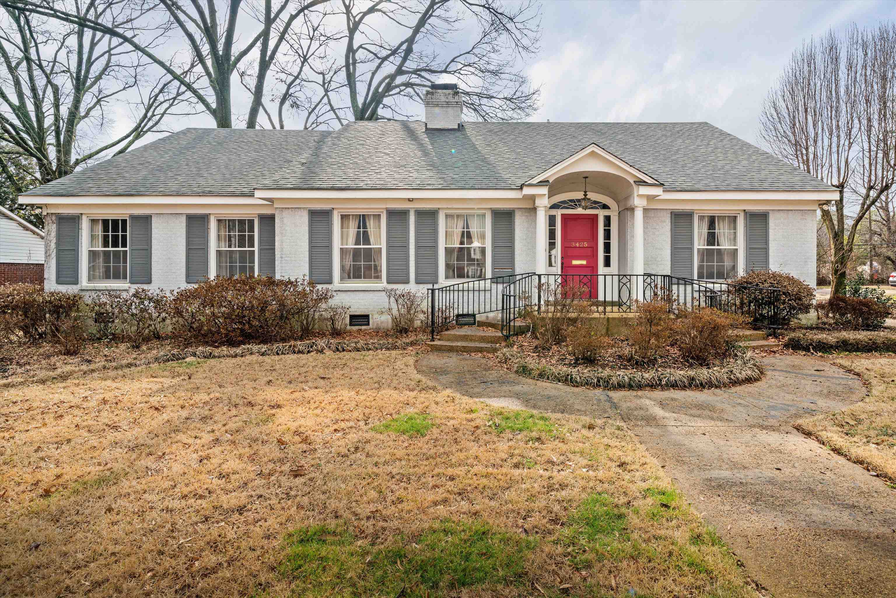 a front view of houses with yard