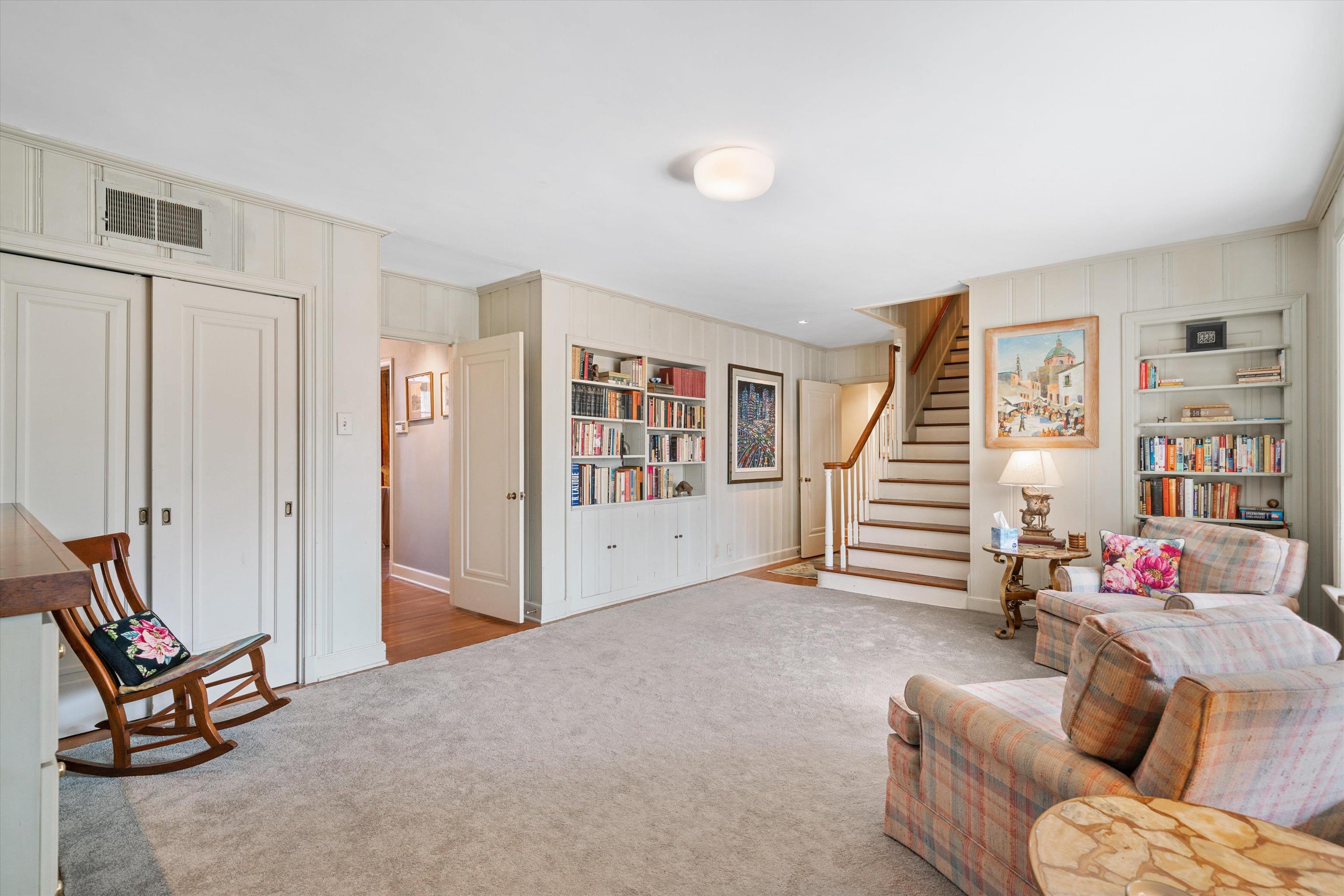 3425 Walnut Grove Road Memphis, TN 38111 - Photo 11 of 25 a living room with furniture and stairs