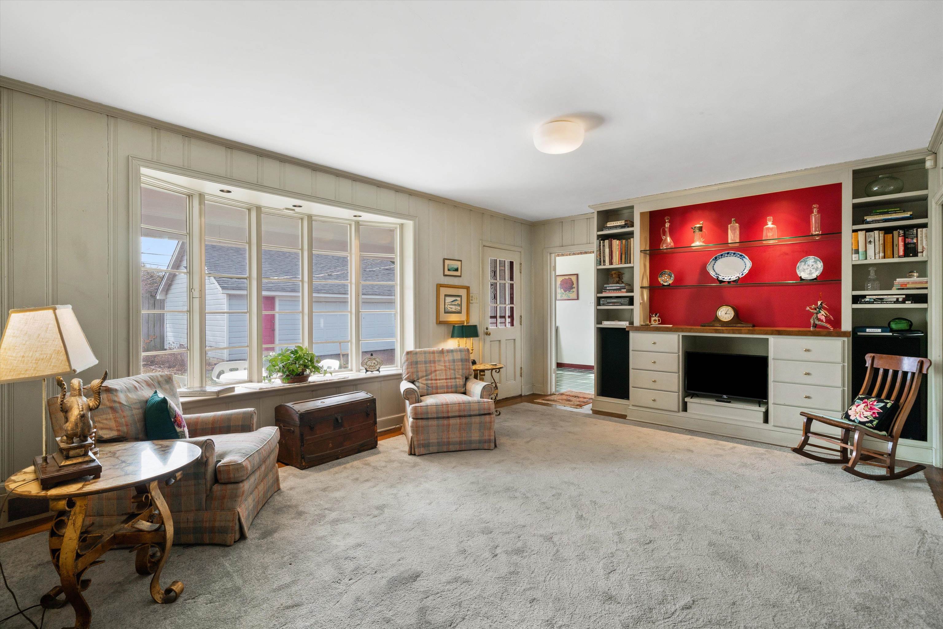 3425 Walnut Grove Road Memphis, TN 38111 - Photo 12 of 25 a living room with furniture a floor to ceiling window and a flat screen tv