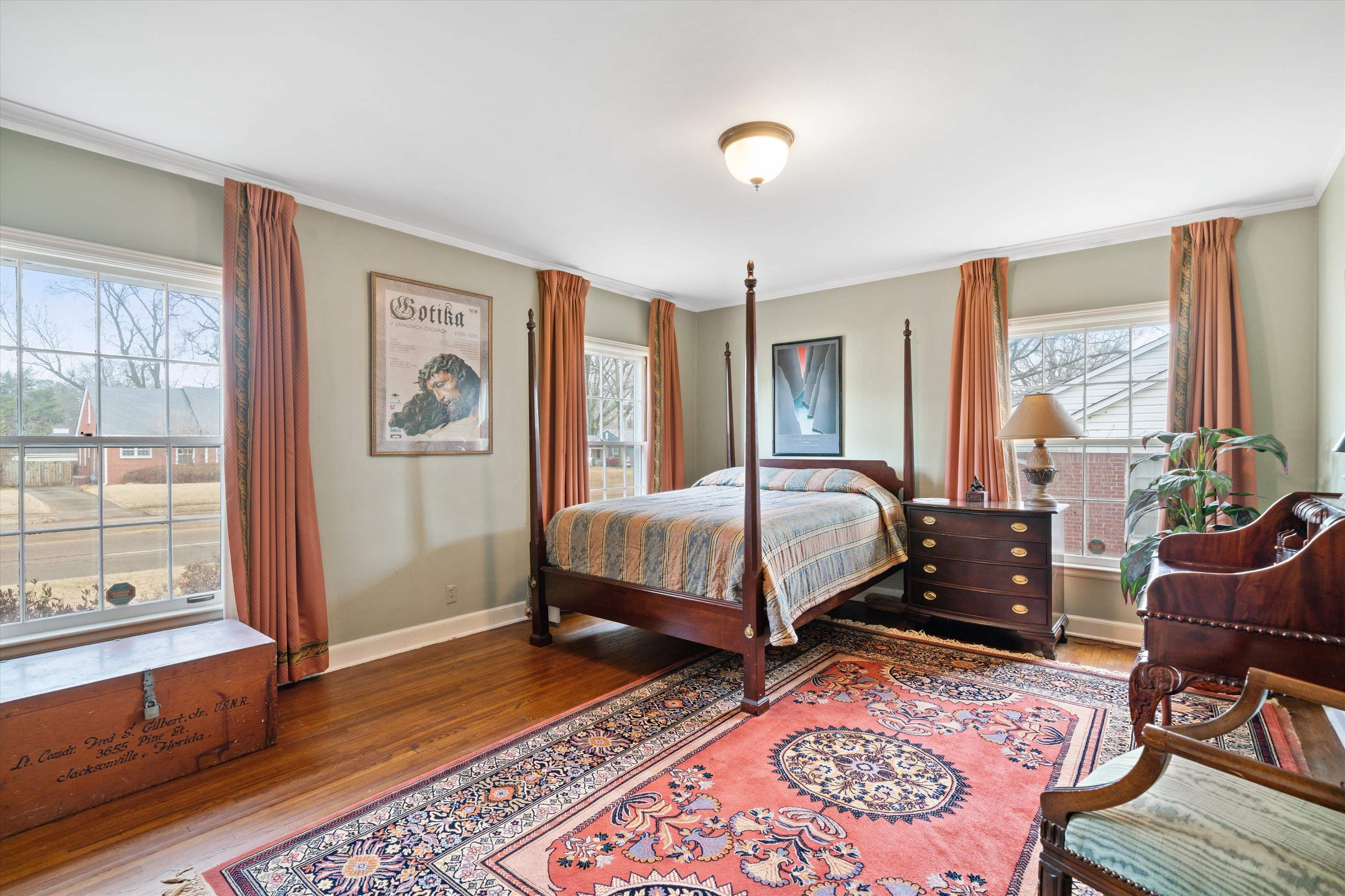 3425 Walnut Grove Road Memphis, TN 38111 - Photo 13 of 25 a bedroom with a bed and wooden floor