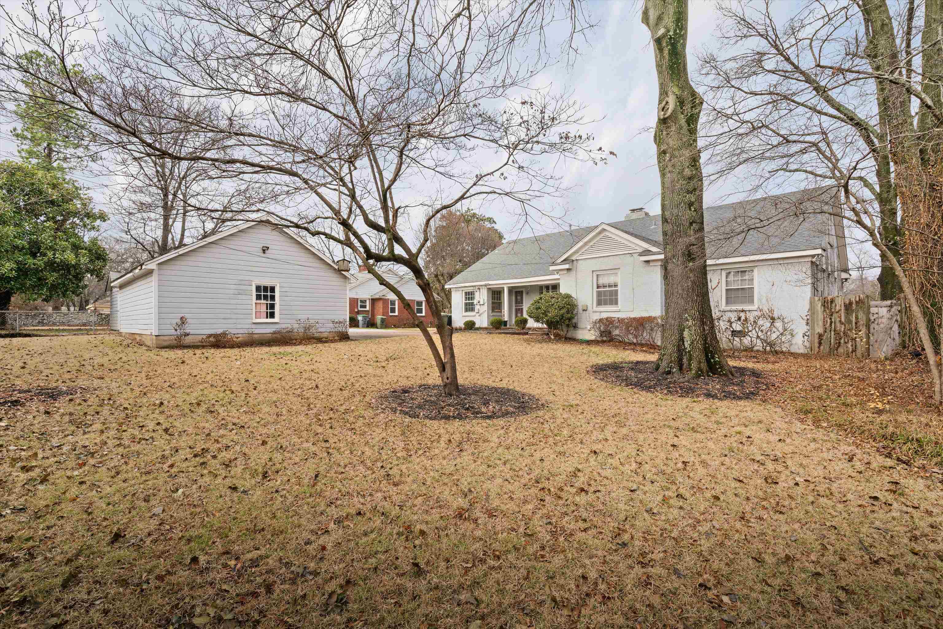 3425 Walnut Grove Road Memphis, TN 38111 - Photo 25 of 25 a white house that has a tree in front of it