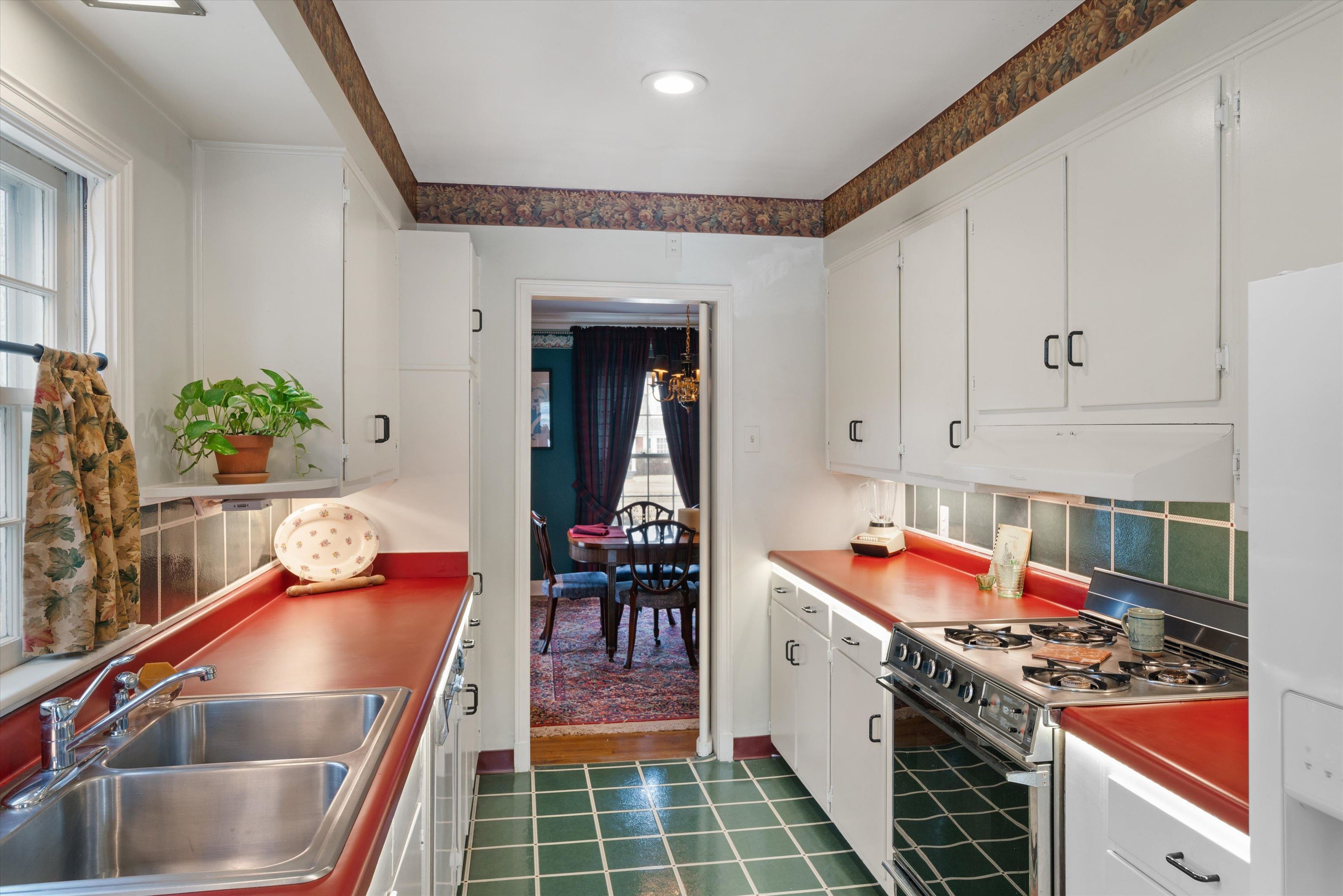 3425 Walnut Grove Road Memphis, TN 38111 - Photo 7 of 25 a kitchen with stainless steel appliances granite countertop a sink stove and cabinets