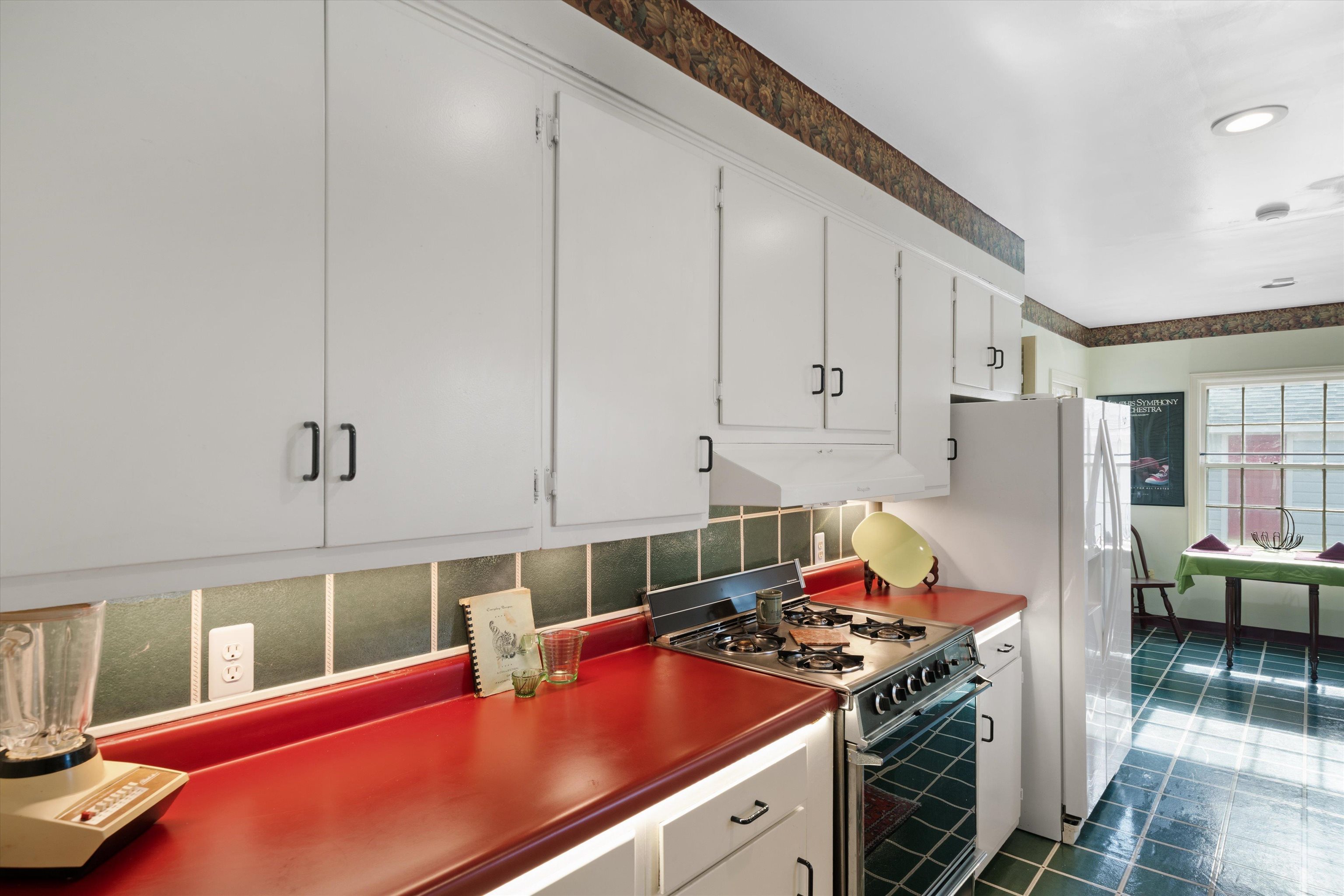 3425 Walnut Grove Road Memphis, TN 38111 - Photo 9 of 25 a kitchen with stainless steel appliances granite countertop a sink stove and cabinets