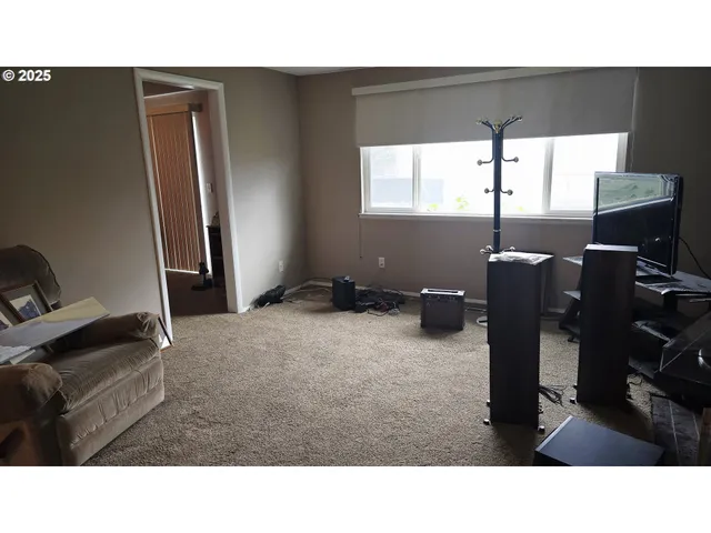 a living room with furniture window and a flat screen tv