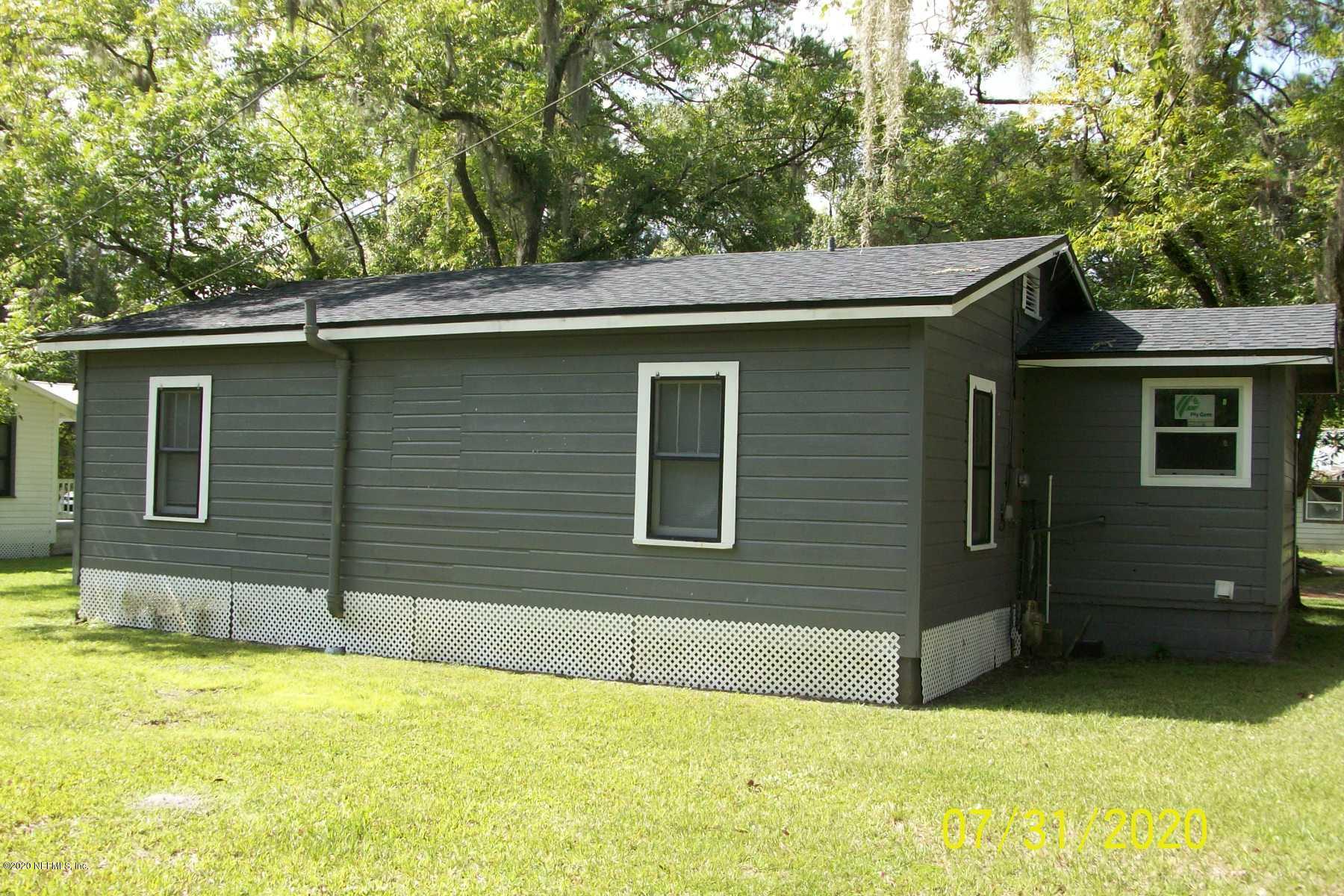 524 St Clair Street Starke, FL 32091 - Photo 11 of 20 a view of a house with a backyard