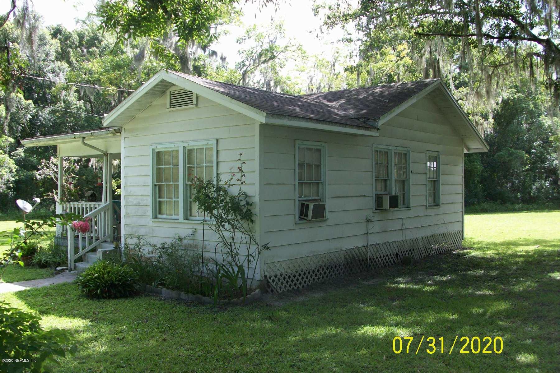 524 St Clair Street Starke, FL 32091 - Photo 16 of 20 a front view of a house with garden