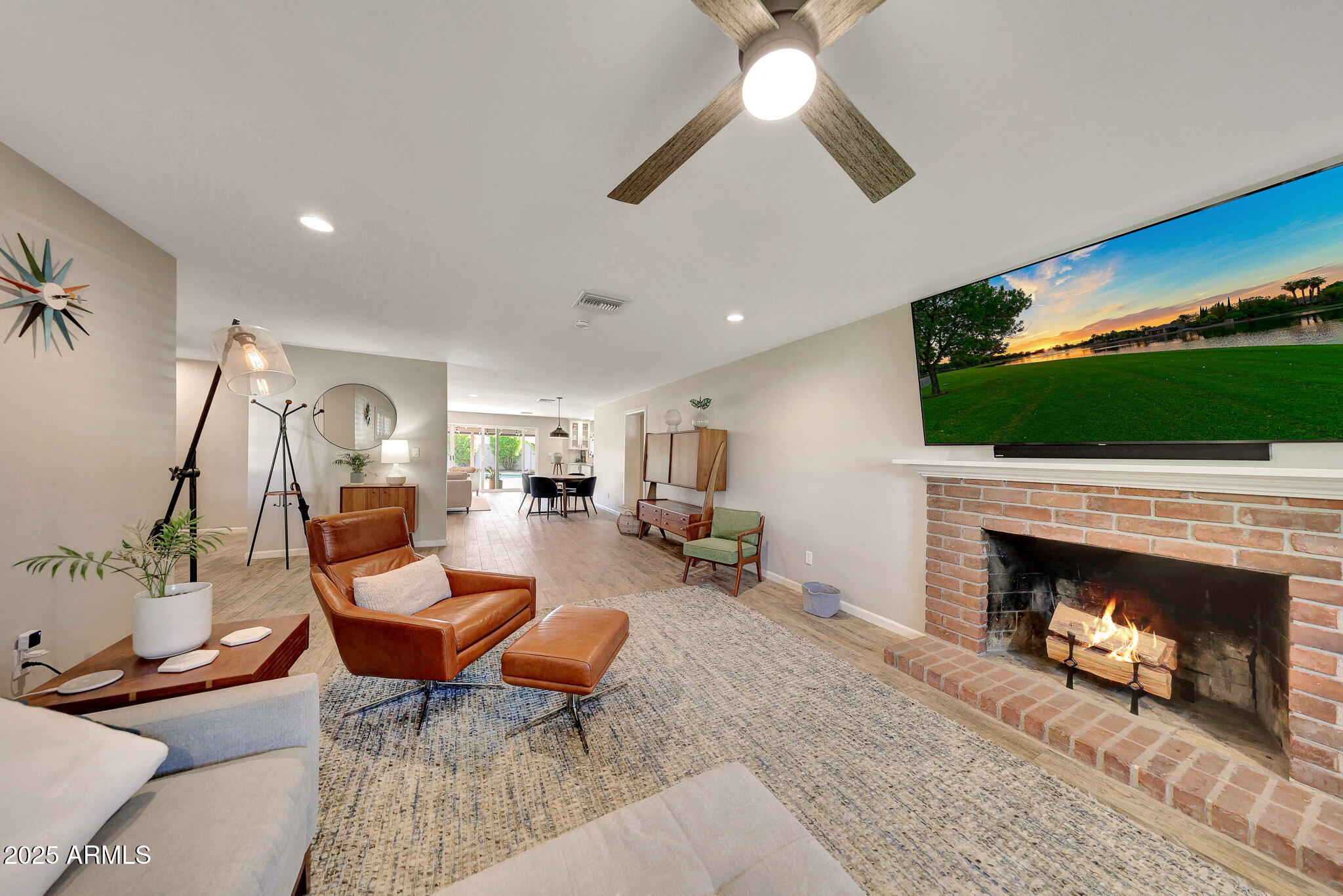 805 West Northview Avenue Phoenix, AZ 85021 - Photo 11 of 51 a living room with furniture a flat screen tv and a fireplace