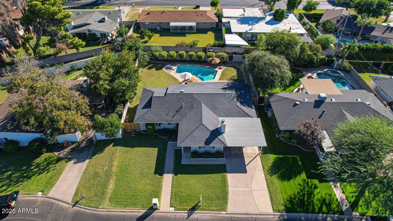 805 West Northview Avenue Phoenix, AZ 85021 - Photo 2 of 51 an aerial view of a house with a garden and lake view