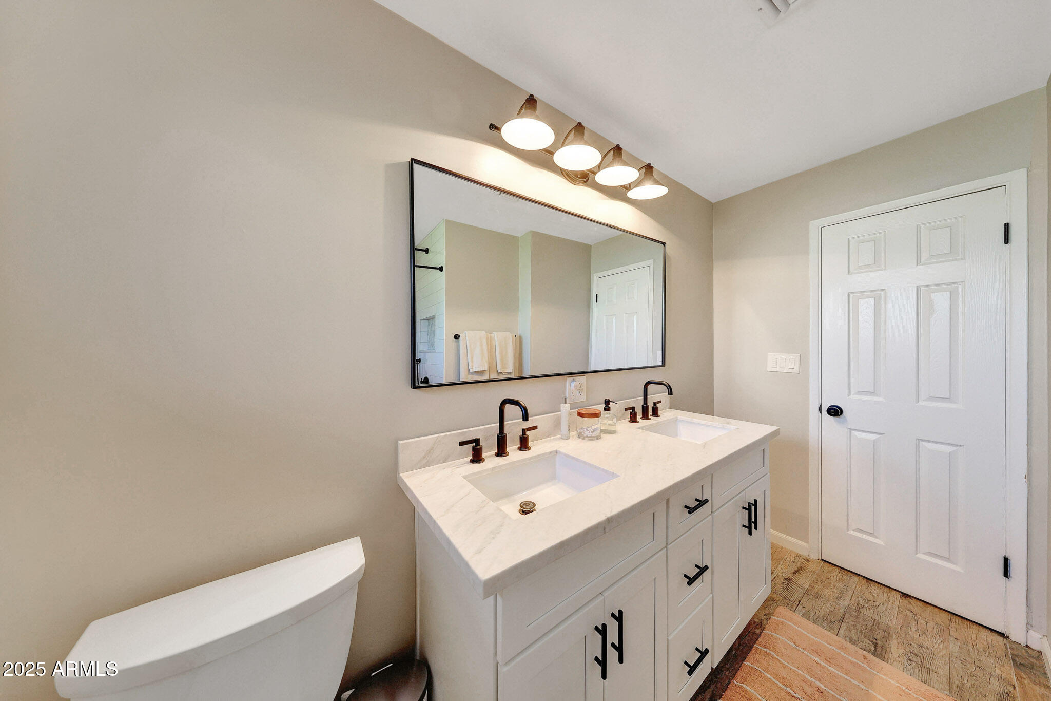 805 West Northview Avenue Phoenix, AZ 85021 - Photo 22 of 51 a bathroom with a toilet sink and mirror