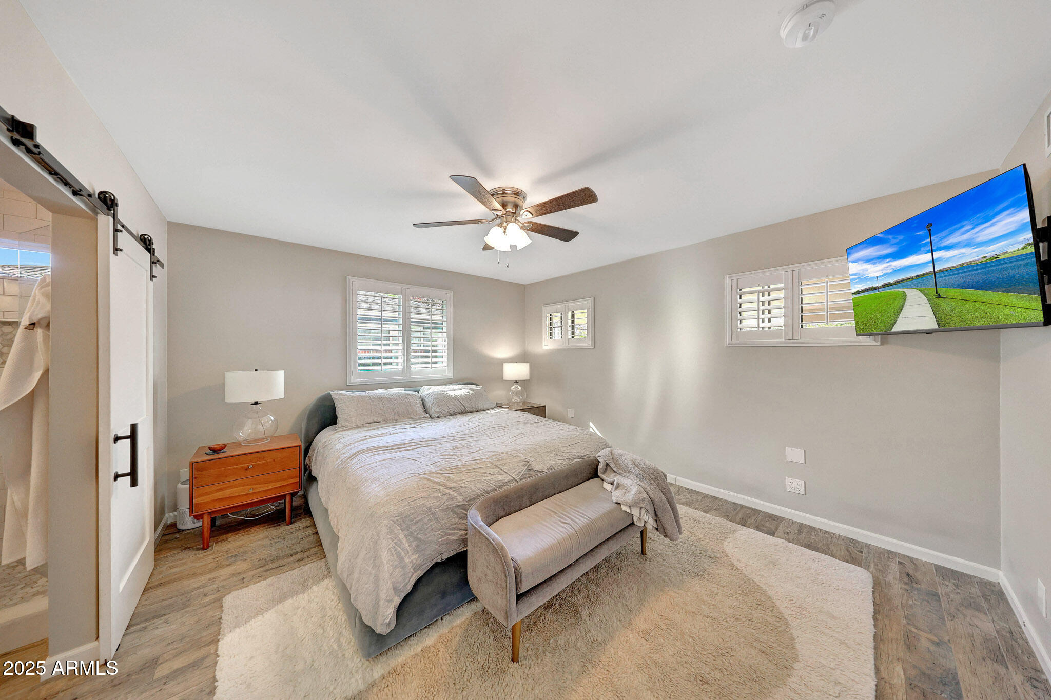805 West Northview Avenue Phoenix, AZ 85021 - Photo 31 of 51 a bedroom with a bed and a chandelier