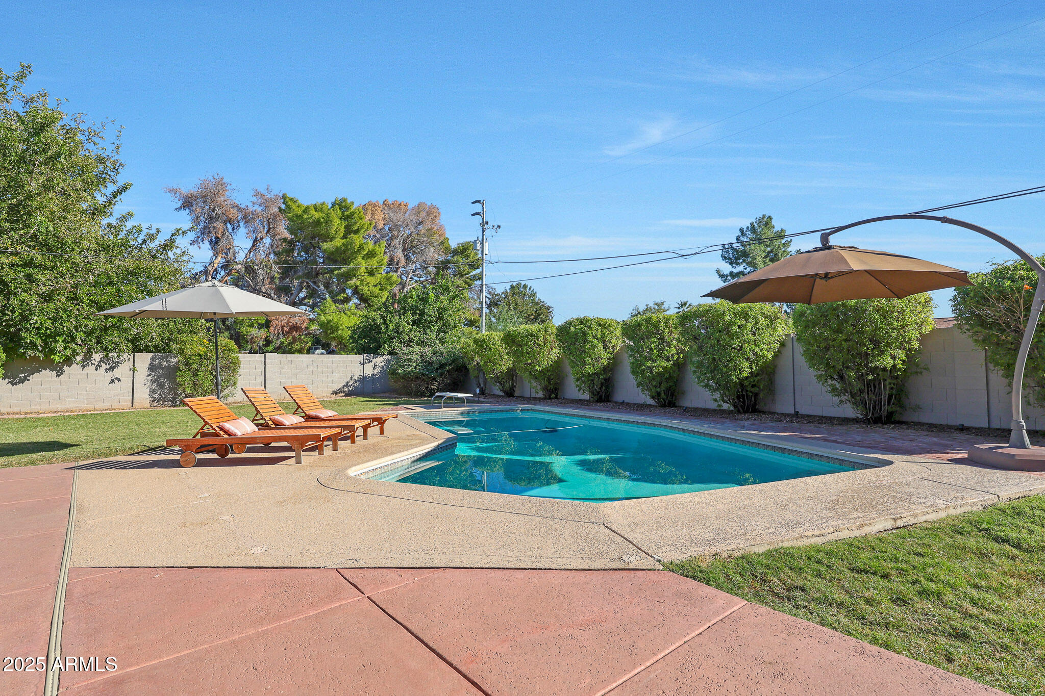 805 West Northview Avenue Phoenix, AZ 85021 - Photo 40 of 51 a view of a swimming pool with an outdoor space and seating area