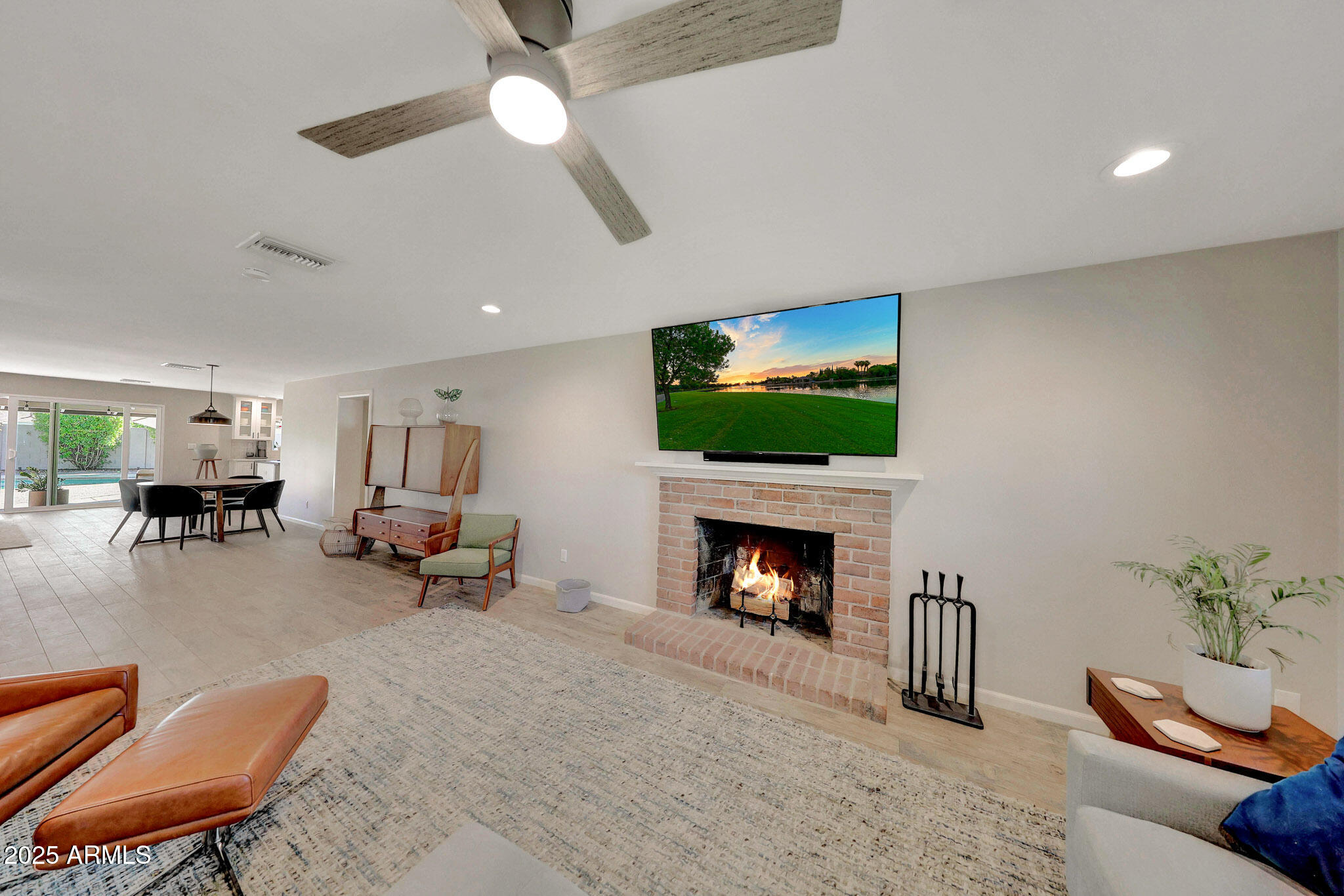 805 West Northview Avenue Phoenix, AZ 85021 - Photo 10 of 51 a living room with furniture flat screen tv and a fireplace