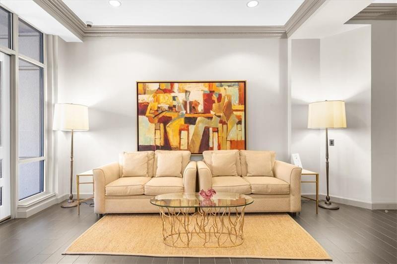 3475 Oak Valley Road Northeast, Unit 410 Atlanta, GA 30326 - Photo 28 of 36 a living room with furniture and a large window