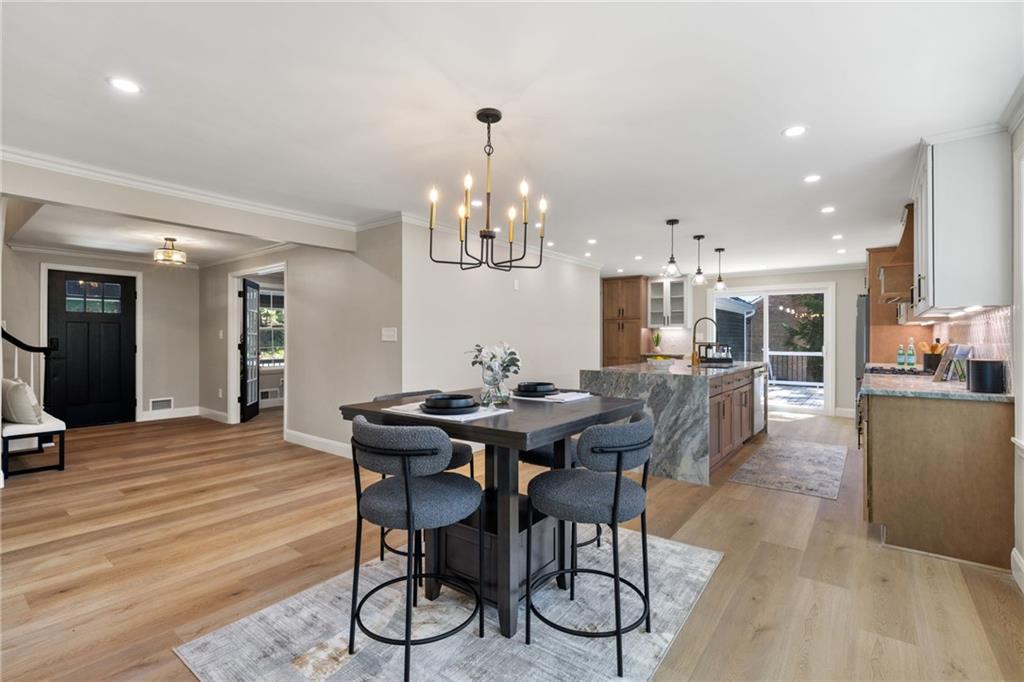 8241 Thompson Run Road Pittsburgh, PA 15237 - Photo 12 of 47 a view of a dining room with furniture and wooden floor