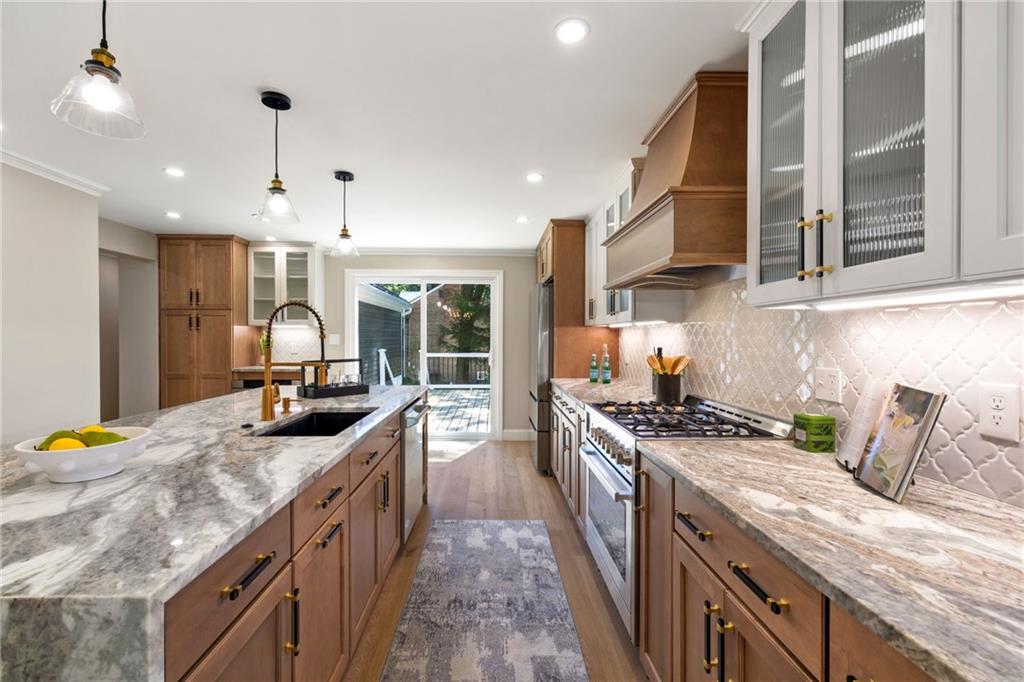 8241 Thompson Run Road Pittsburgh, PA 15237 - Photo 15 of 47 a kitchen with stainless steel appliances granite countertop a stove a sink and a refrigerator