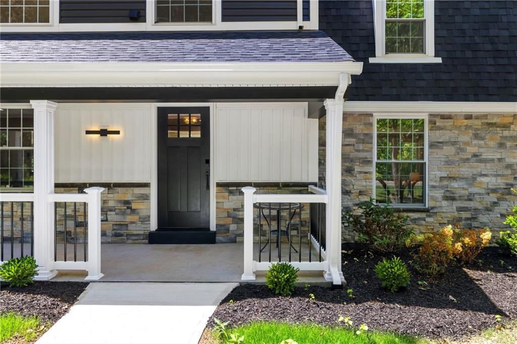 8241 Thompson Run Road Pittsburgh, PA 15237 - Photo 2 of 47 a front view of a house with a garden