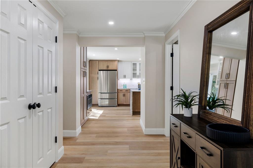 8241 Thompson Run Road Pittsburgh, PA 15237 - Photo 21 of 47 a view of a hallway with wooden floor and staircase