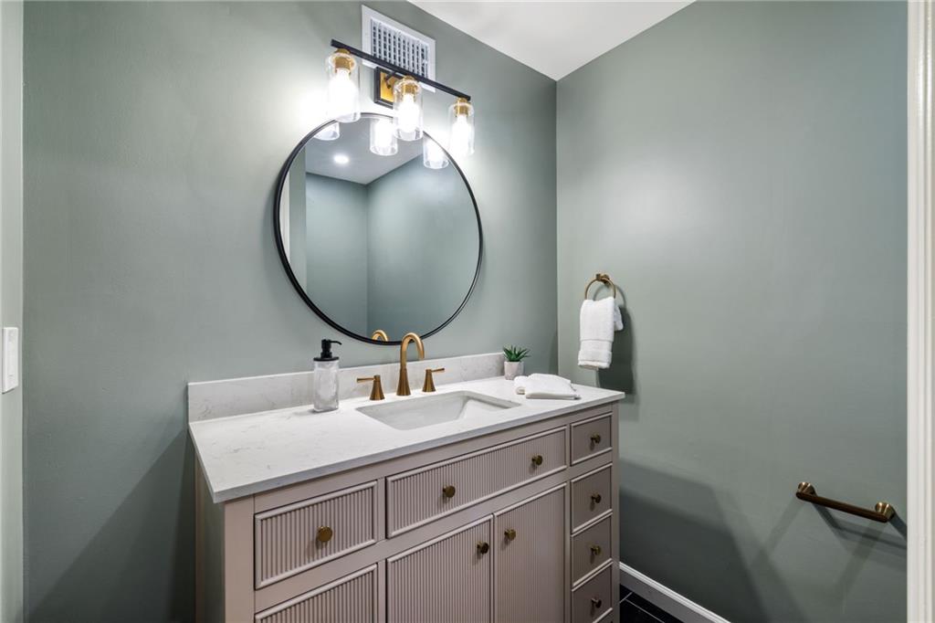 8241 Thompson Run Road Pittsburgh, PA 15237 - Photo 22 of 47 a bathroom with a sink and a mirror