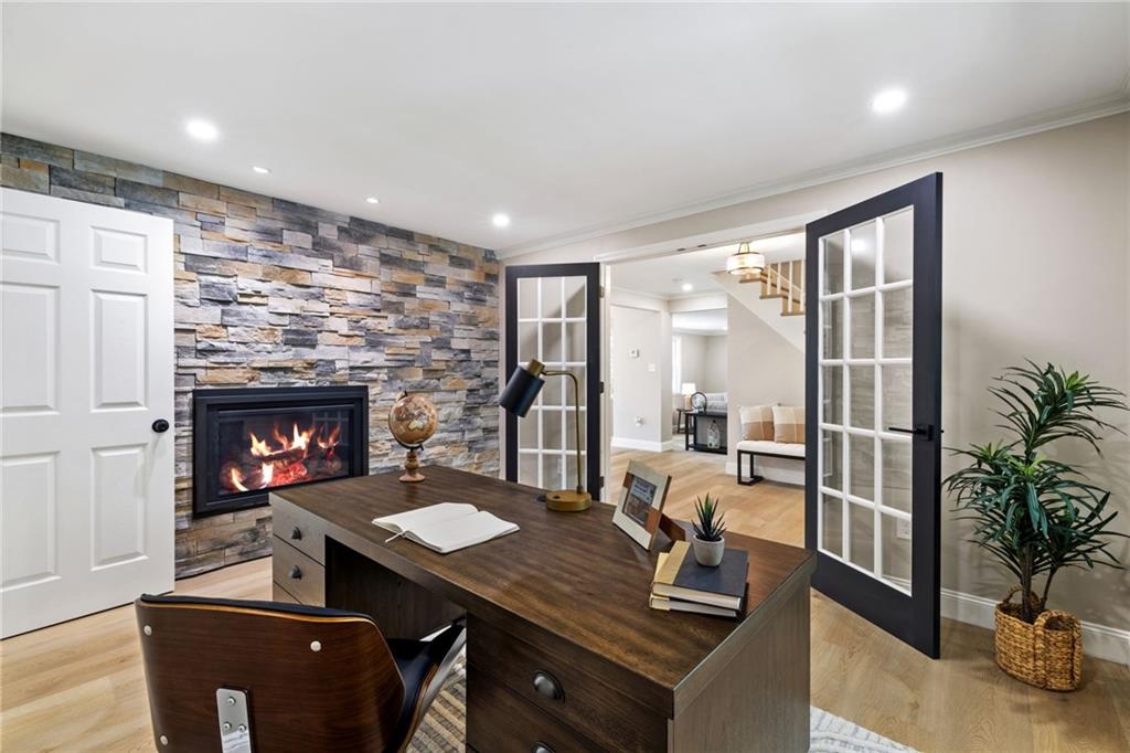 8241 Thompson Run Road Pittsburgh, PA 15237 - Photo 25 of 47 a view of a workspace with furniture and a fireplace