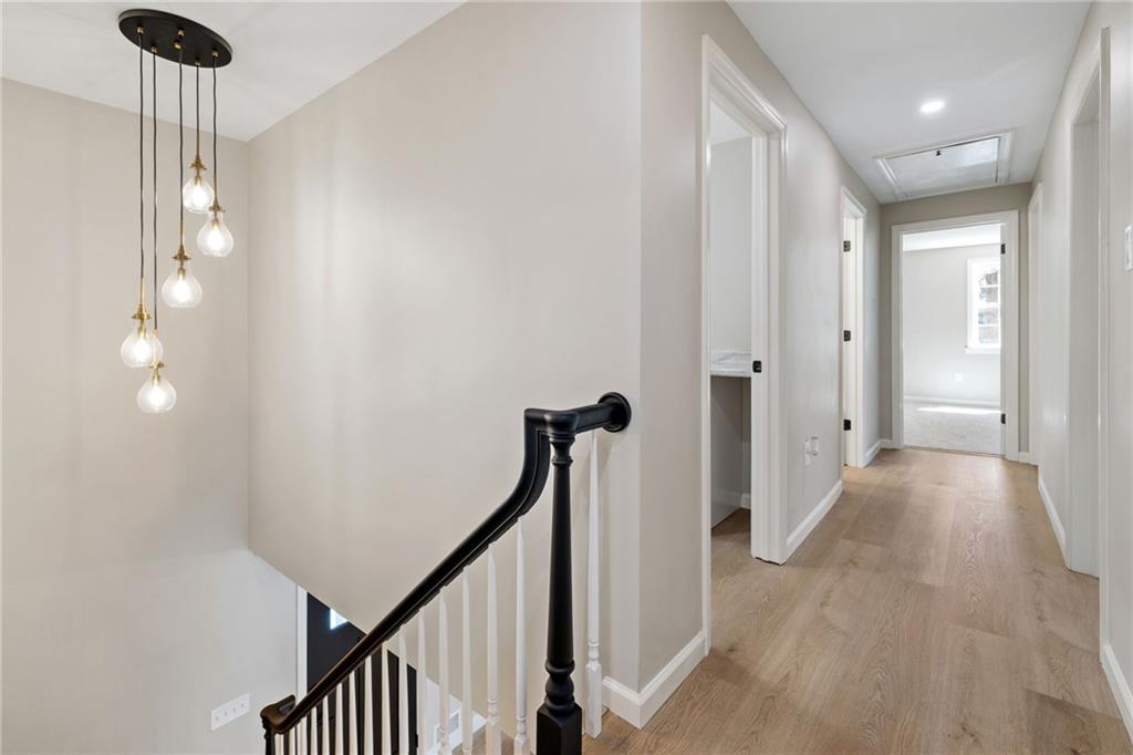 8241 Thompson Run Road Pittsburgh, PA 15237 - Photo 27 of 47 a view of a hallway with wooden floor and staircase