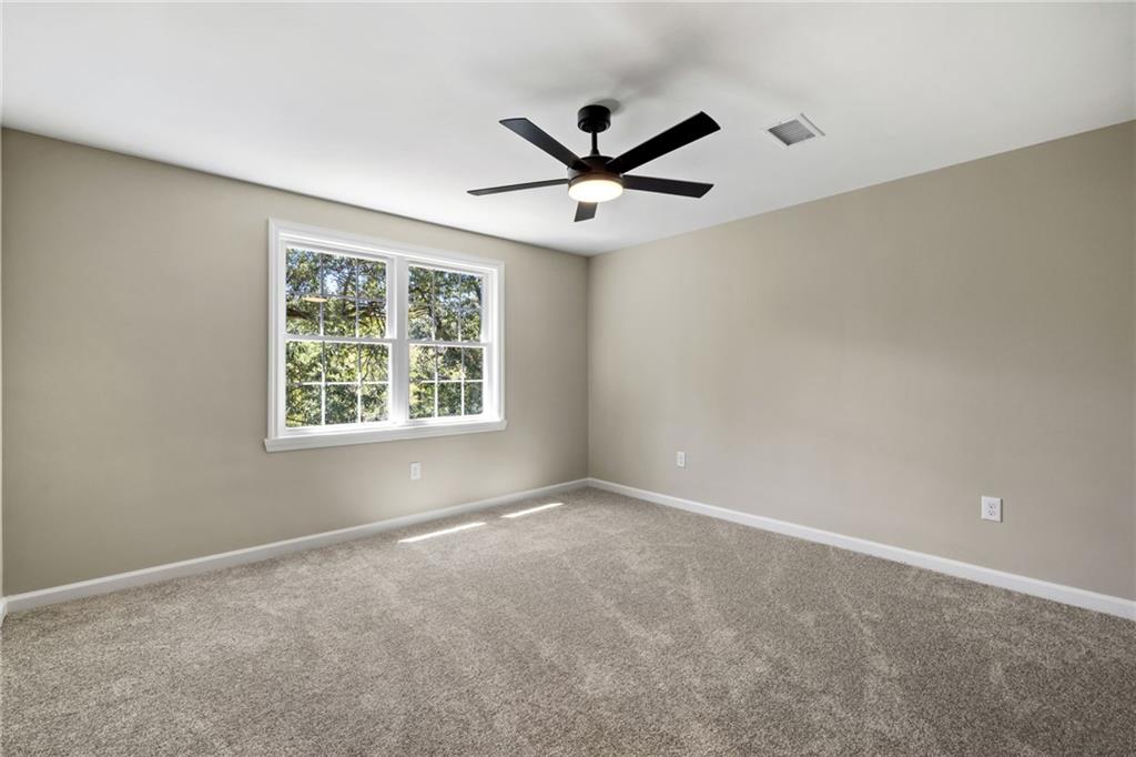 8241 Thompson Run Road Pittsburgh, PA 15237 - Photo 29 of 47 an empty room with a window and a fan