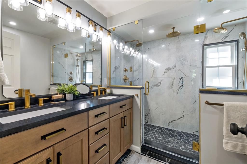 8241 Thompson Run Road Pittsburgh, PA 15237 - Photo 42 of 47 a bathroom with a double vanity sink and a mirror