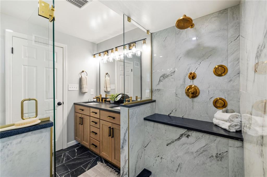 8241 Thompson Run Road Pittsburgh, PA 15237 - Photo 43 of 47 a bathroom with a double vanity sink mirror and shower