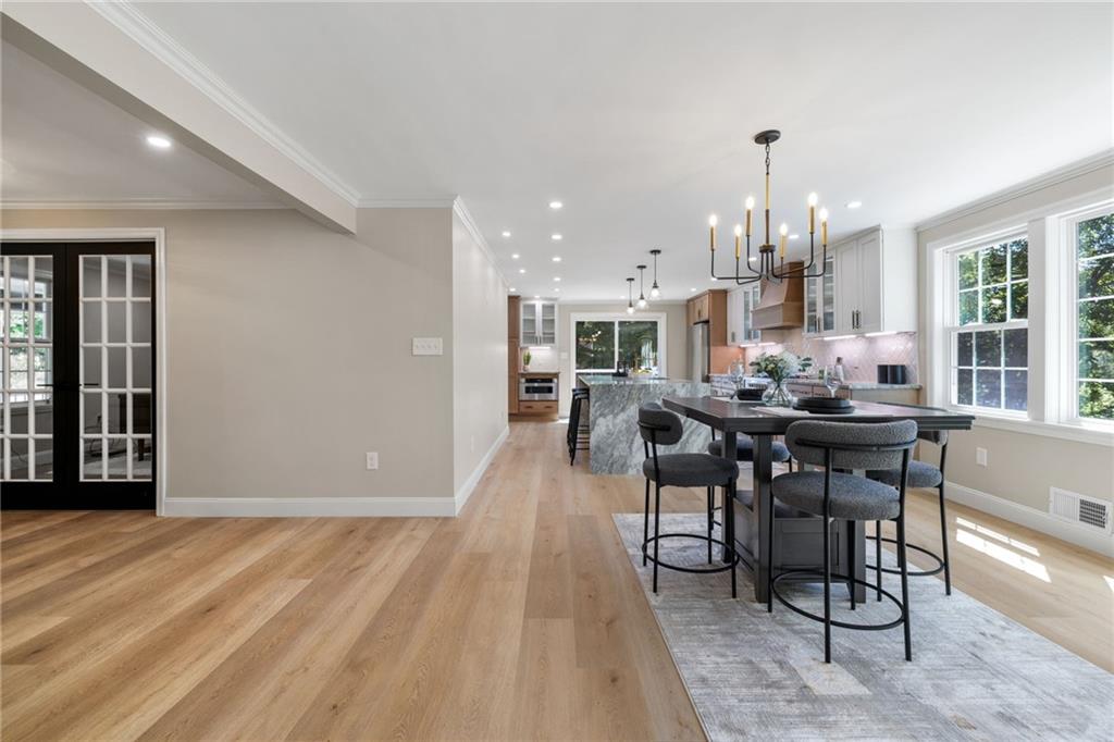8241 Thompson Run Road Pittsburgh, PA 15237 - Photo 9 of 47 a dining hall with stainless steel appliances kitchen island granite countertop a dining table chairs and view living room