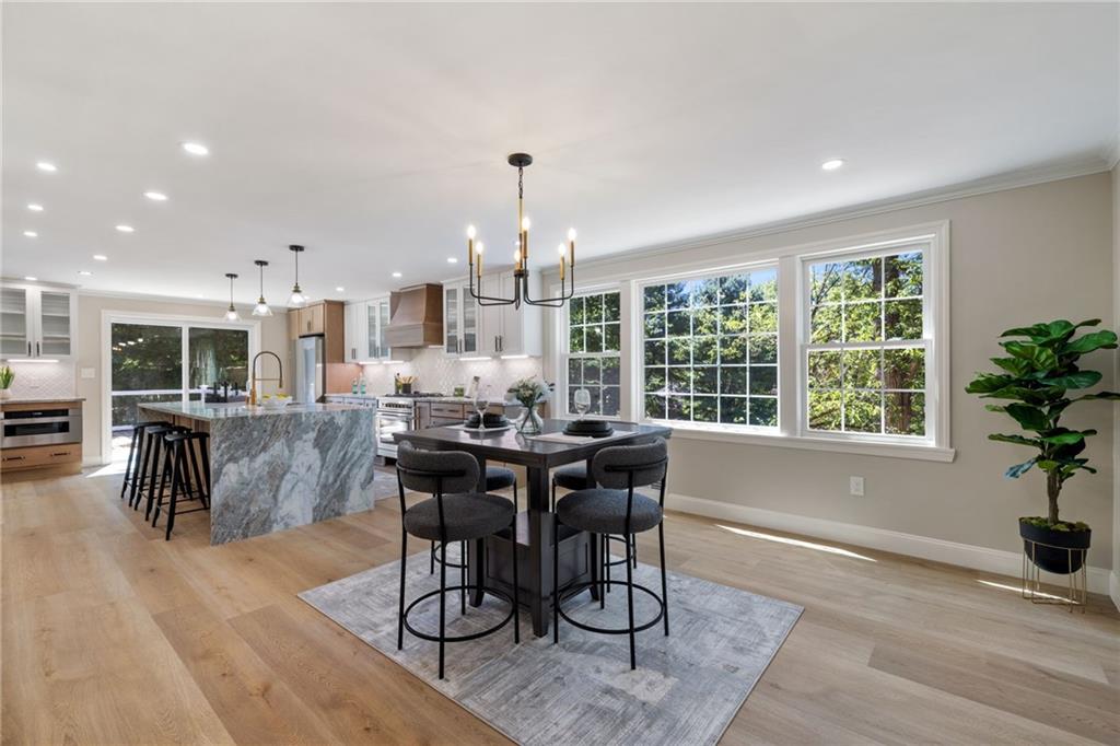 8241 Thompson Run Road Pittsburgh, PA 15237 - Photo 10 of 47 a dining room with furniture potted plants and wooden floor