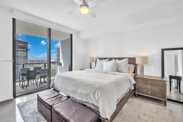 a bathroom with a shower and a sink
