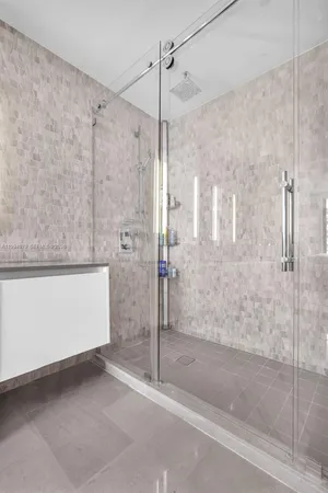 a living room with furniture and a book shelf