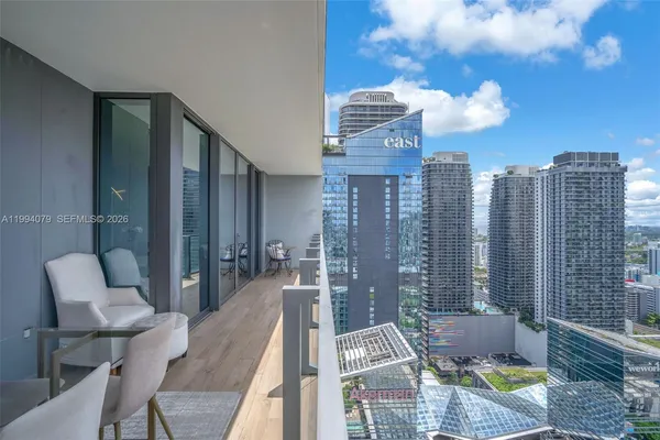 a view of a house with backyard and porch