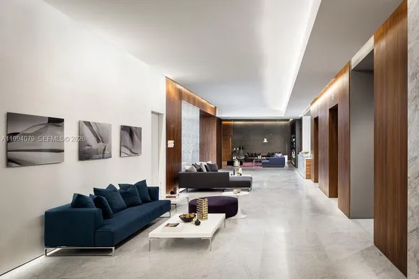 a bedroom with a bed and a large mirror